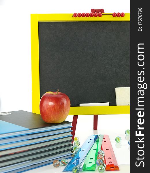 Blackboard with books and apple. Blackboard with books and apple