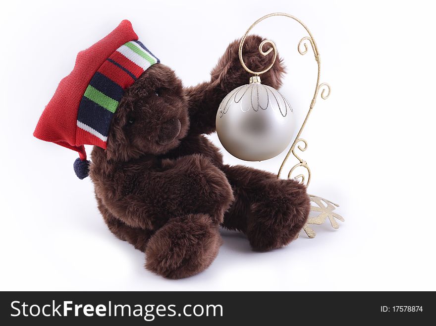 Bear with Christmas decor sitting on white background