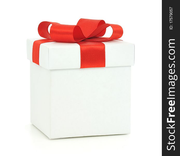 White gift box with a red bow on white background. White gift box with a red bow on white background