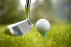 Golf Ball On Tee In Front Of Driver Royalty Free Stock Image