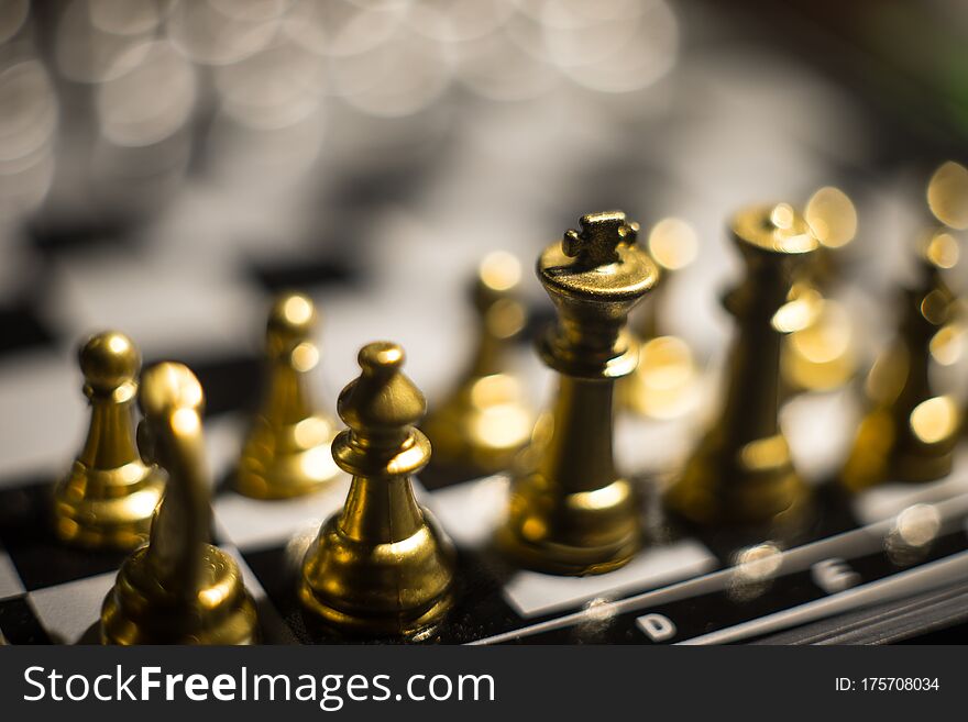 Chess Figures On A Dark Background With Smoke And Fog. Selective Focus