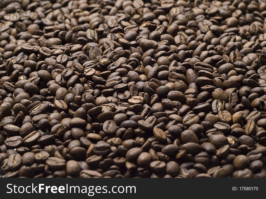 Sprinkle of coarse grains of black coffee. Sprinkle of coarse grains of black coffee