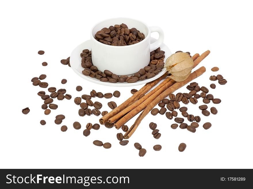 Coffee cup coffee beans and cinnamon
