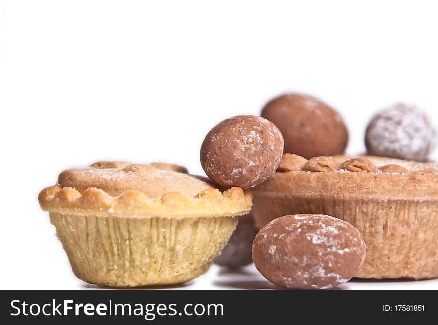 Mince pies and chocolate eggs isolated on white background