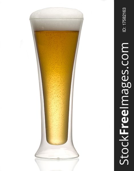 Beer into glass isolated on white