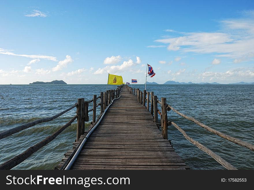 Ferry Bridge in the Sea with Flags