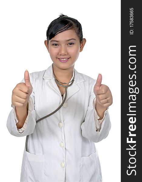 Beautiful young doctor show her thumbs and wearing white coat isolated over white background. Beautiful young doctor show her thumbs and wearing white coat isolated over white background