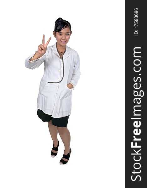 Beautiful young doctor gesturing peace and wearing white coat isolated over white background. Beautiful young doctor gesturing peace and wearing white coat isolated over white background