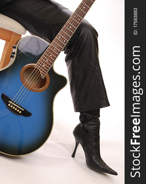 Blue Guitar And High Heeled Boot