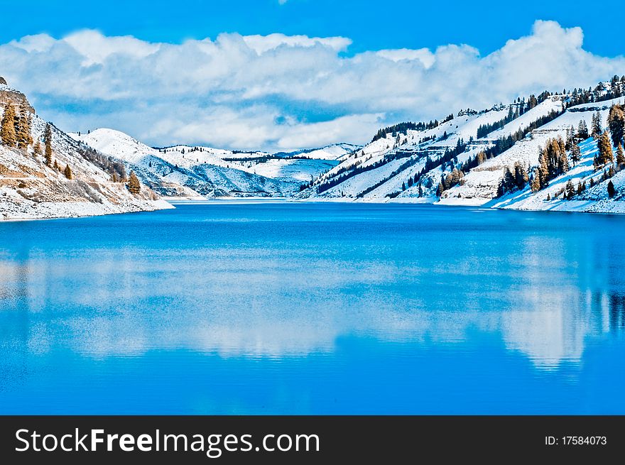 Lake in the snow covered mountains. Lake in the snow covered mountains.