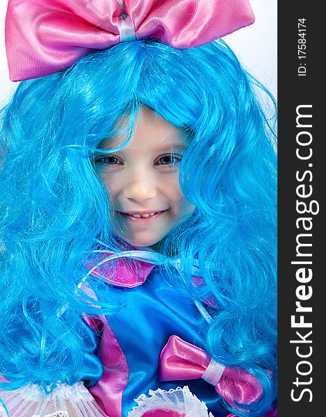 Little girl with blue hair close-up on white background. Little girl with blue hair close-up on white background