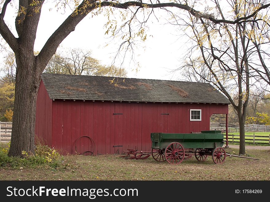 Vintage Horsecart in front of a farm building in autumn