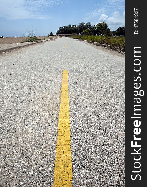 A closeup picture of a yellow road divider