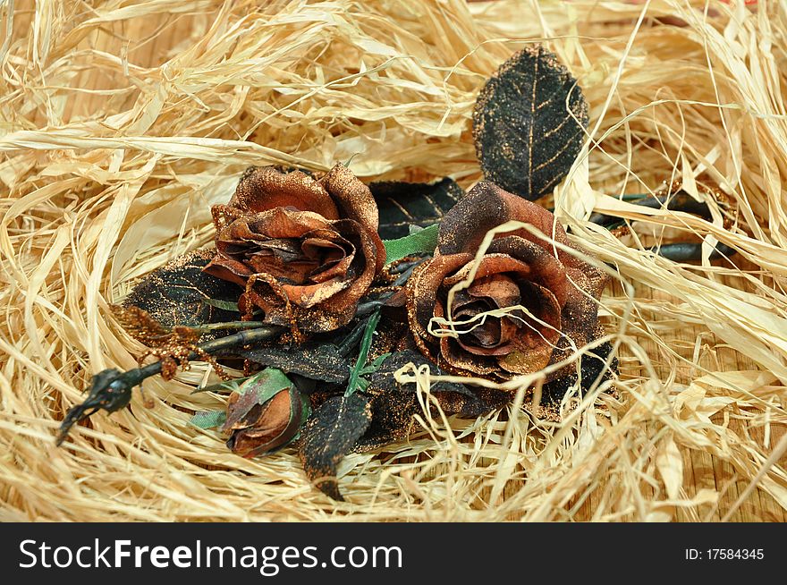 Roses over raffia fibers background. Roses over raffia fibers background