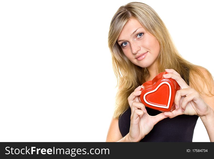Smiling Young Woman Holding a red Heart. Isolated on white background. Smiling Young Woman Holding a red Heart. Isolated on white background