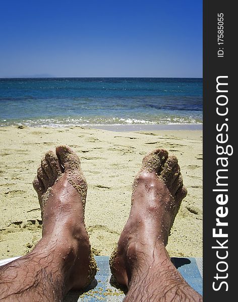 Man relaxing on the Beach with blue Sky. Man relaxing on the Beach with blue Sky