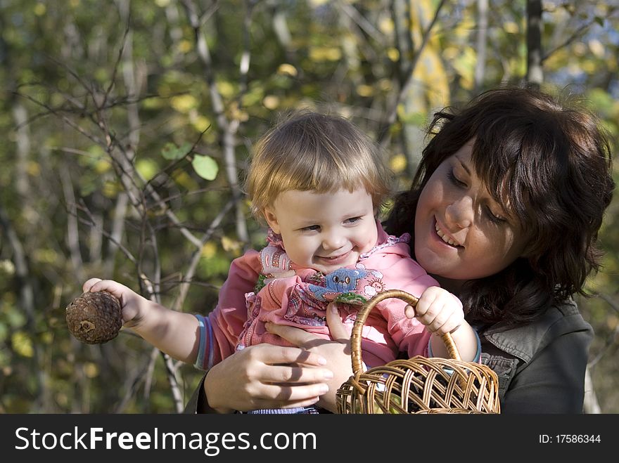 Mother plays the nature with the two-year daughter. Mother plays the nature with the two-year daughter