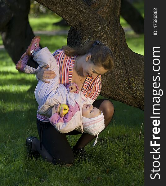 mother plays the nature with the two-year daughter. mother plays the nature with the two-year daughter