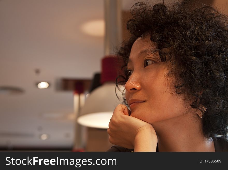 Portrait of a young Chinese woman in restaurant. Portrait of a young Chinese woman in restaurant