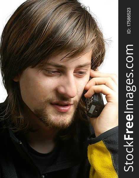 Bearded young men talking by telephone