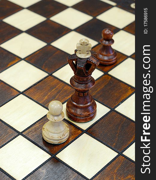 Wooden Chess Figures On Game Board