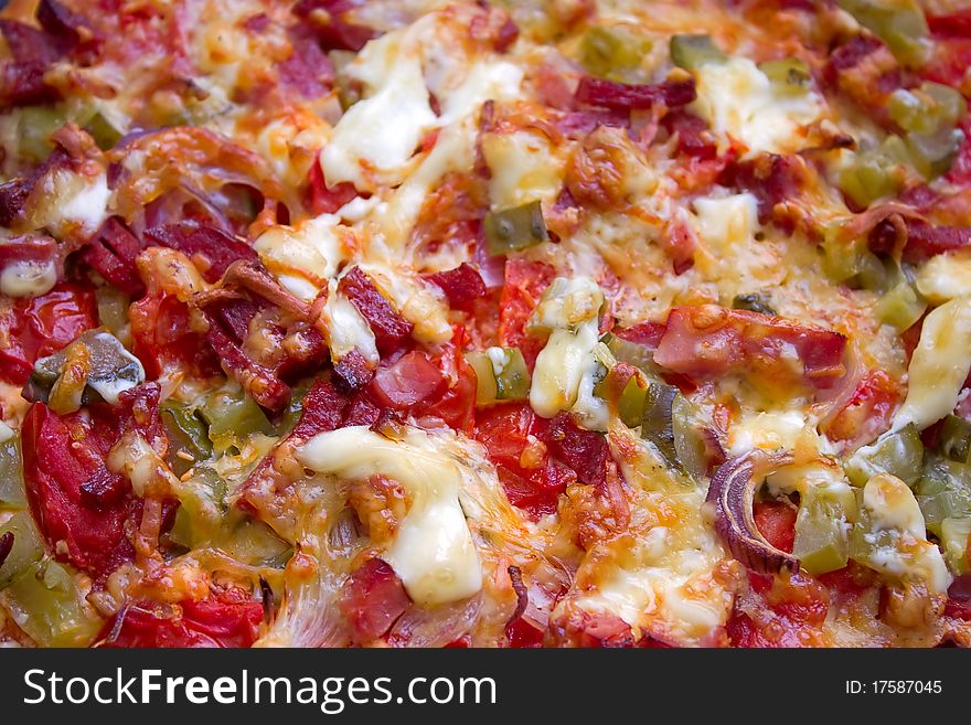 Closeup of finished pizza toppings. Horizontal image.