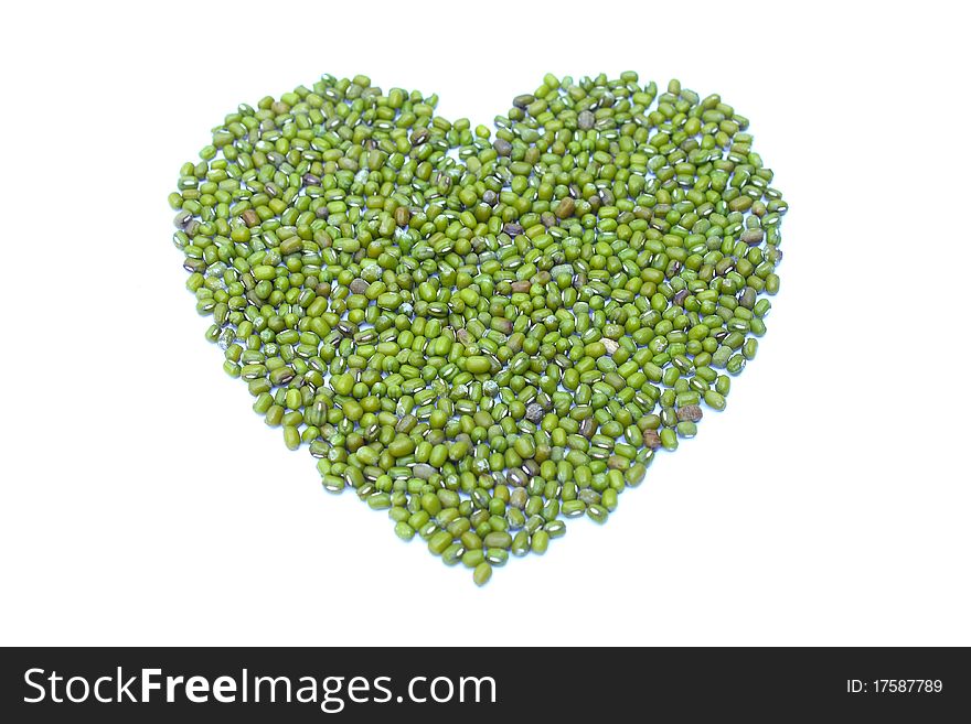 Green heart  from green nut on white background