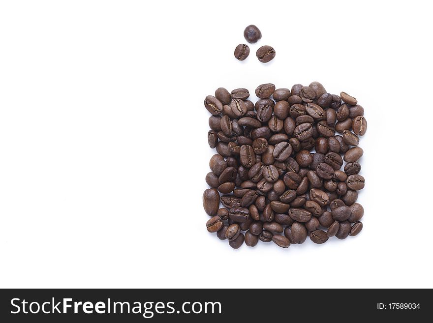 Fried Coffee bean are put by a rectangle and three grains separately on a white background. Fried Coffee bean are put by a rectangle and three grains separately on a white background