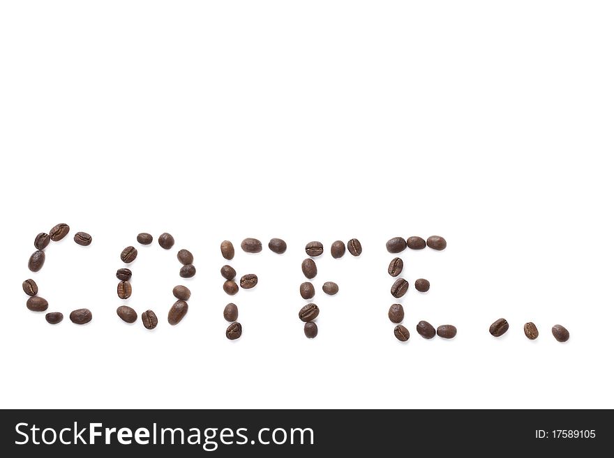 Inscription сoffe...made with coffee beans on a white background horizontal frame. Inscription сoffe...made with coffee beans on a white background horizontal frame