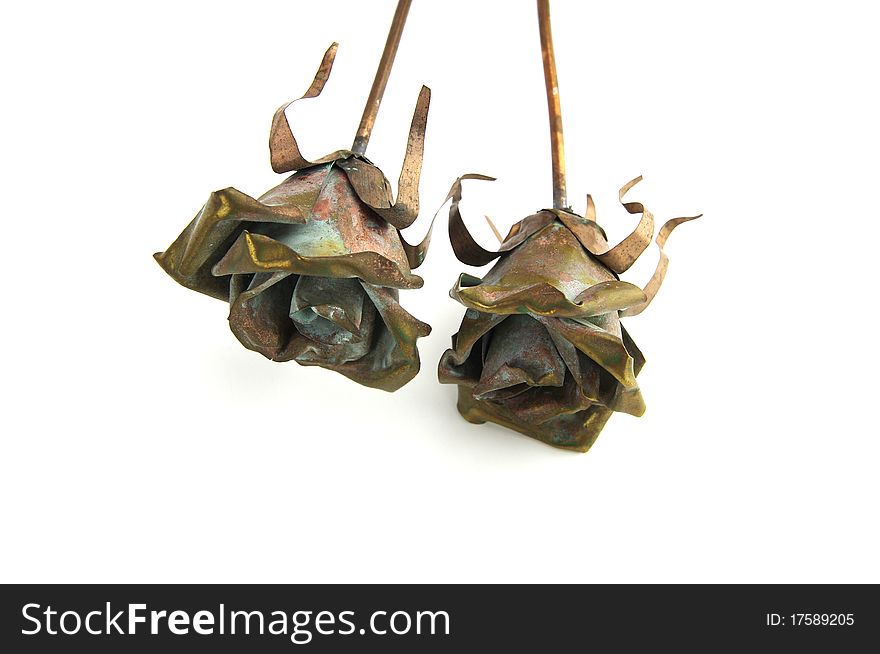 Two metal rose decorations