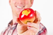 Youn Man With An Apple With Hearts Royalty Free Stock Images Youn Man With An Apple With Hearts Royalty Free Stock Images