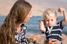 Mother And Baby Boy At The Beach Stock Images