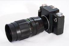 SLR Camera With A Big Lens. Royalty Free Stock Photography SLR Camera With A Big Lens. Royalty Free Stock Photography