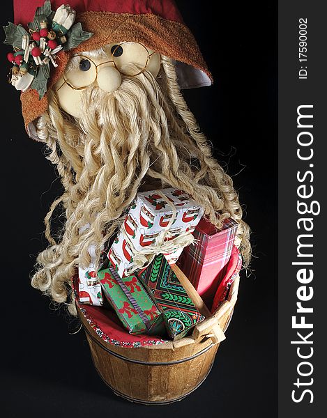 Wood bucket of Christmas gift with Santa Claus