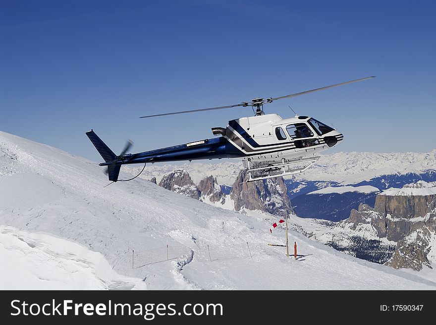 Helicopter landing in ski region Sella Ronda Italy