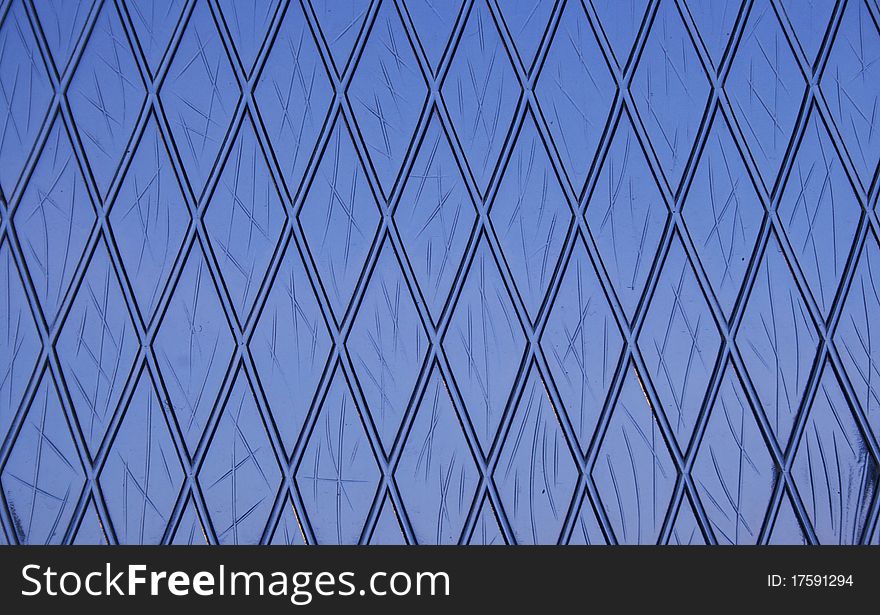 A sheet of glass with a grid pattern. A sheet of glass with a grid pattern