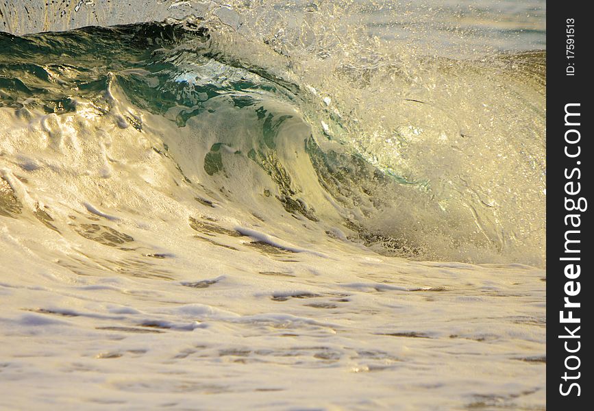 Clear water wave crashing in Hawaii