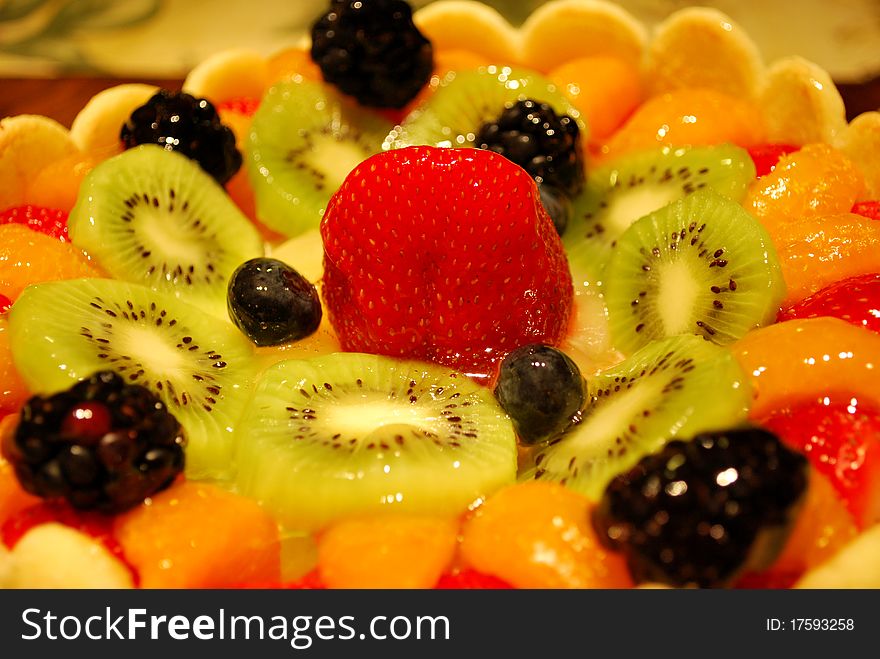 Delicious fruit cake with strawberries, kiwi and other berries. Delicious fruit cake with strawberries, kiwi and other berries