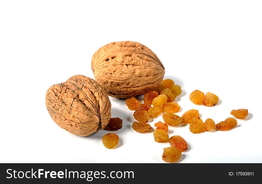 Walnuts and raisins on a white background