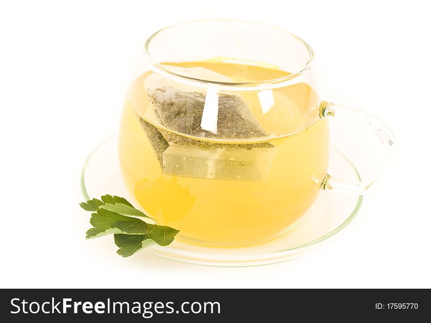 Transparent tea cup on white background