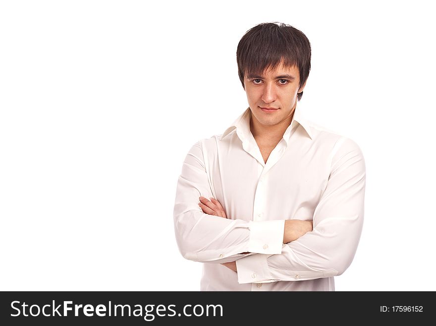 The serious guy in a white shirt on a white background. The serious guy in a white shirt on a white background