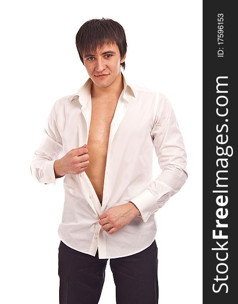 The young guy undresses on a white background. The young guy undresses on a white background