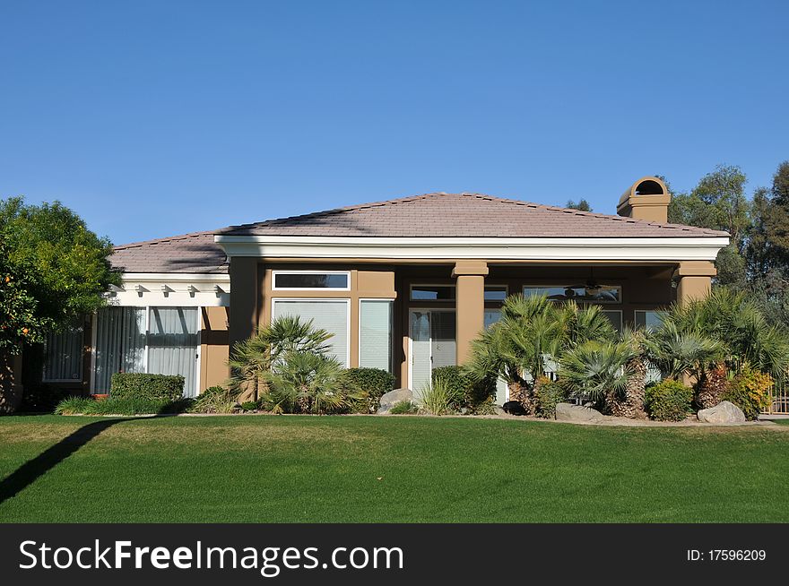 House Surrounded By Trees And Grass