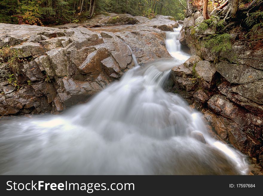 Small waterfall called the basin in New Hampshire in autumn