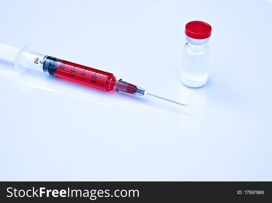 Hypodermic Needle And Medicine Bottle