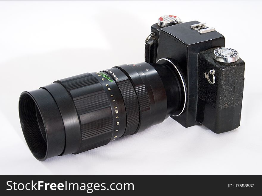 Black SLR camera with a large telescopic lens. 35mm. Black SLR camera with a large telescopic lens. 35mm