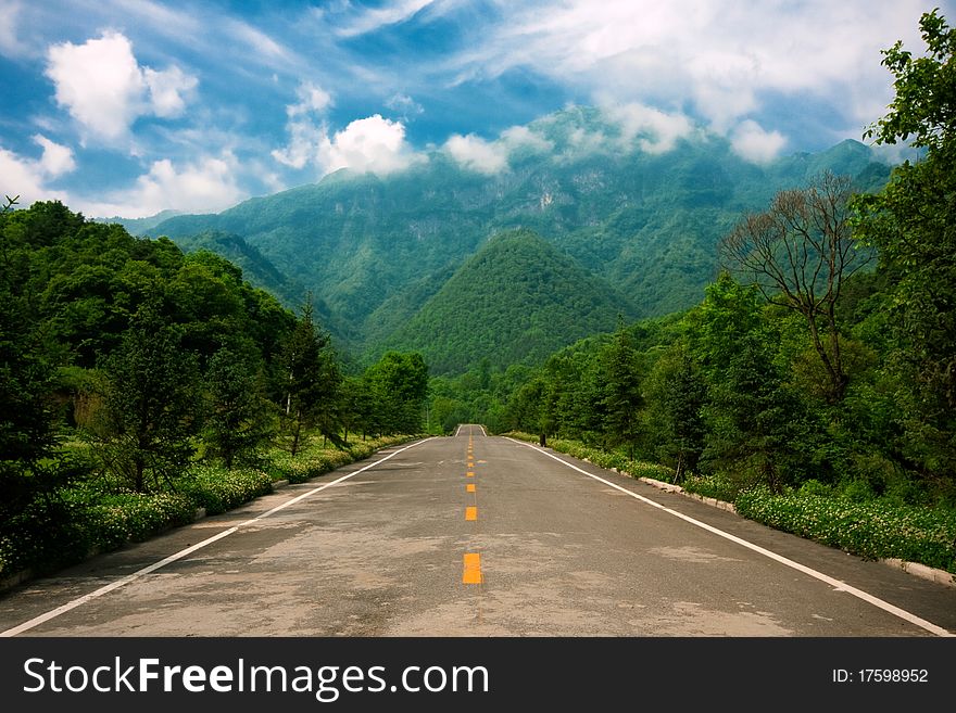 IN the mountain area,a road. IN the mountain area,a road