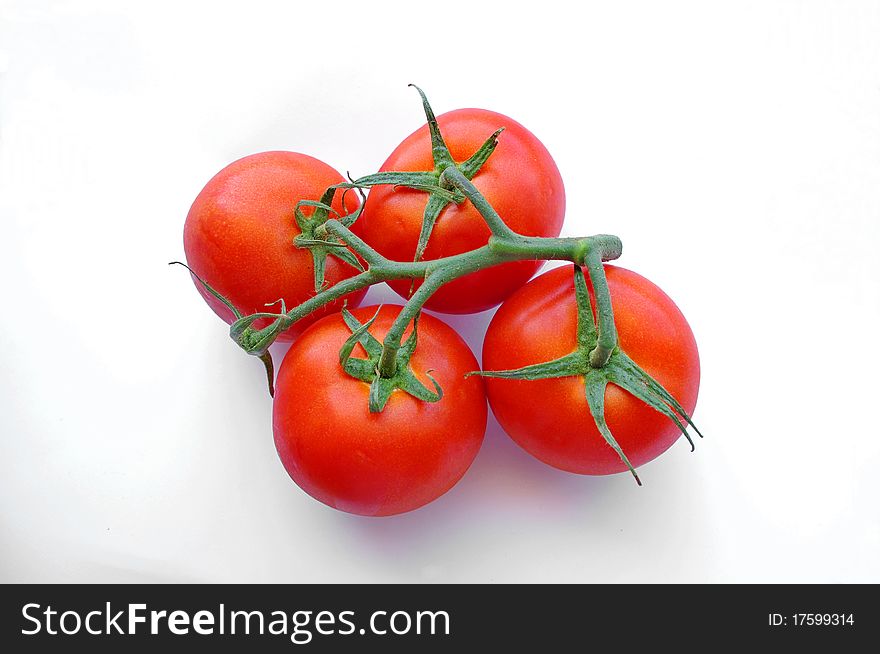 Red tomatos isolated on white