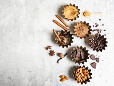 Baking Ingredients: Brown Sugar, Cocoa, Almond, Dark Chocolate And Spices On A Gray Marble Background. Top View. Copy Space Royalty Free Stock Photography