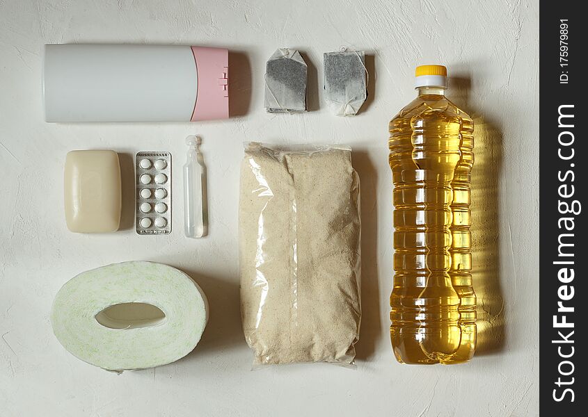 Layout On A Light Background Of High-demand Items Toilet Paper, Soap, Antiseptic, Tablets, Flour, Shampoo, Tea